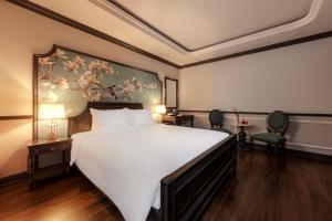 Postel nebo postele na pokoji v ubytování Sapa Soleil Hotel
