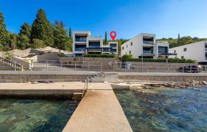 a body of water with buildings in the background at 2 Bedroom Stunning Apartment In Omisalj in Omišalj
