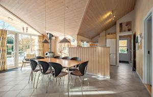 a kitchen and dining room with a table and chairs at Amazing Home In Oksbøl With Wifi in Oksbøl