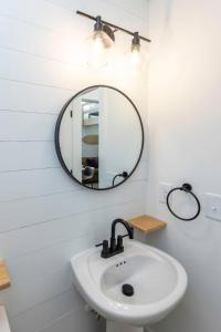 a bathroom with a sink and a mirror at Ocean Lofts in the Vibe #3 - 5 min walk to beach in Virginia Beach