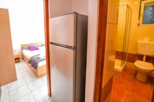 Ένα μπάνιο στο Apartments Rucmarin