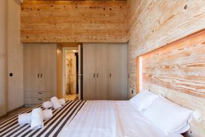 Posteľ alebo postele v izbe v ubytovaní Lenico Beachfront Suites