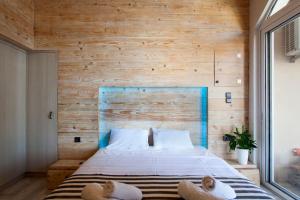 Posteľ alebo postele v izbe v ubytovaní Lenico Beachfront Suites