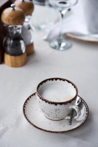 a cup of coffee sitting on a table at Joyway Hotels Istanbul Sultanahmet in Istanbul