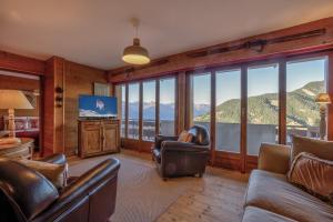 a living room with a view of a mountain at Appartement Bellevue 527 in La Tzoumaz