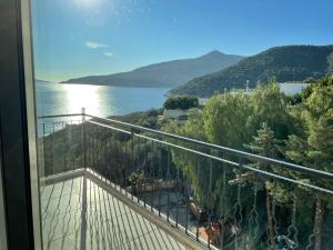 a balcony with a view of the water at Grand süit 402 in Kalkan