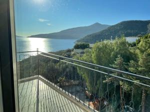 a balcony with a view of the water at Grand süit in Kalkan +22 photos