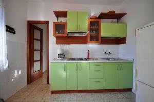 Kuchyň nebo kuchyňský kout v ubytování Adria apartments