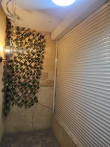 a room with a wall of wine bottles at Duplex by Aqua Maadi Degla Group 5 stars in Cairo