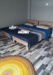 two twin beds in a room with at Mountain Dream House in Gudauri