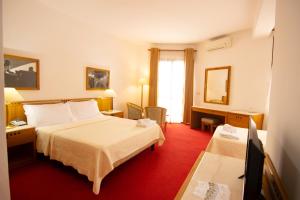 Postel nebo postele na pokoji v ubytování Chateau Linza Resort