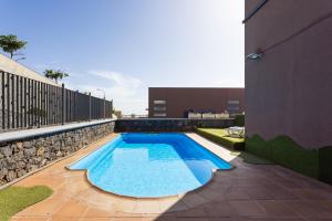 a swimming pool in front of a building at Home2Book Charming House Private Pool & Terrace in Santa Cruz de Tenerife