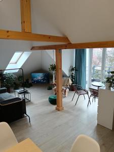 a living room filled with furniture and a large window at Apartman Barbara in Lipany