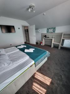 En eller flere senger på et rom på Casa Elena - Resort & SPA