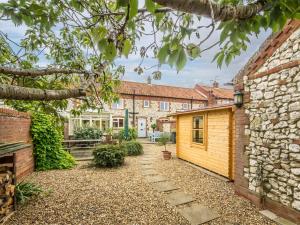 a view of the courtyard of a house at 3 Bed in Thornham KT111 in Thornham