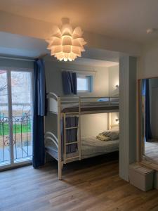 Poschodová posteľ alebo postele v izbe v ubytovaní Bohobos Hostel