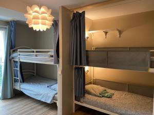 Voodi või voodid majutusasutuse Bohobos Hostel toas