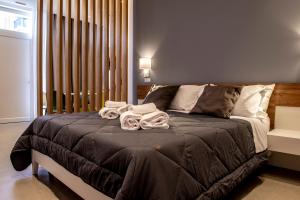 Letto o letti in una camera di Alipa Suite with Jacuzzi