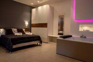 Letto o letti in una camera di Alipa Suite with Jacuzzi