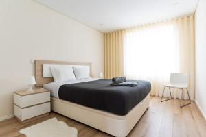 Ένα ή περισσότερα κρεβάτια σε δωμάτιο στο Mifi Beach Luxury Duplex by MP