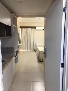 a room with a bedroom and a bed in it at Spazzio diRoma - Com acesso ao Acqua park in Caldas Novas
