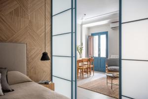 a bedroom with a bed and a dining room at SEISSTA Madrid Centro "Remodelado" in Madrid