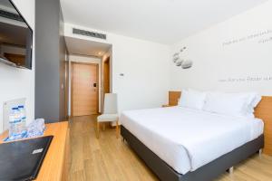 Postel nebo postele na pokoji v ubytování TRYP by Wyndham Leiria