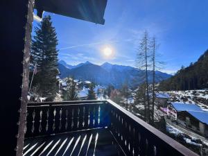 a balcony with a view of the mountains at Ferienhaus Vardaval - Schmitten / GR in Schmitten