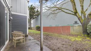 a bench sitting on the side of a house at Landing Modern Apartment with Amazing Amenities (ID1274X054) in Vancouver