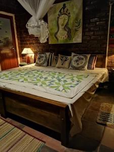 A bed or beds in a room at OM SHAMBALA Yoga Ashram