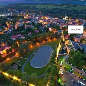 an overhead view of a city at night with a basketball court at Apartament Górski Widok in Duszniki Zdrój