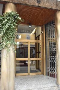 an entrance to a building with a glass door at Appartamenti Bruzzanese in Milan