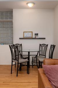 a dining room with a table and four chairs at Flexhome Wicker Park 2BR P1 - READ INFO in Chicago