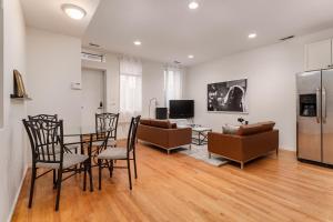 a kitchen and living room with a table and chairs at Flexhome Wicker Park 2BR P1 - READ INFO in Chicago
