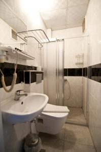 a bathroom with a sink and a toilet and a shower at Golden Horn Life Hotel- FULL BOARD in Istanbul +31 photos
