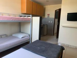 Ένα ή περισσότερα κρεβάτια σε δωμάτιο στο Pousada terraco Rio Centro