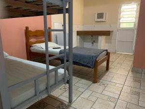 Ένα ή περισσότερα κρεβάτια σε δωμάτιο στο Pousada terraco Rio Centro