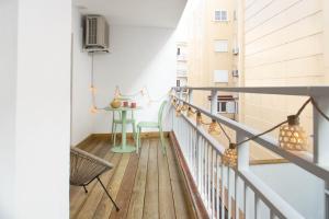 a small balcony with a table and a chair at Budget Beach Studio 23 in Sant Antoni de Calonge