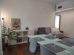 a living room with a table and a couch at Appartamento - Rho Centro 6 - in Rho