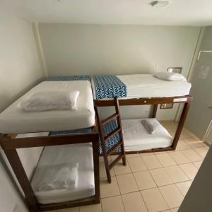 a room with two bunk beds in a room at Hostal Casa Huasteca in Ciudad Valles