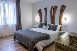 Postel nebo postele na pokoji v ubytování Hotel rural Finca Vivaldi Nature & Spa