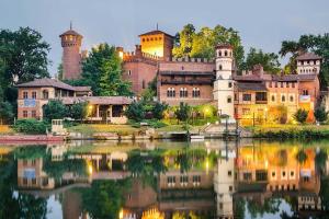 a large castle with a lake in front of it at [Centro] Splendido Appartamento di Design in Turin