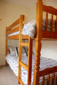a pair of bunk beds in a bedroom at Aelfor Cottage in Barmouth in Barmouth