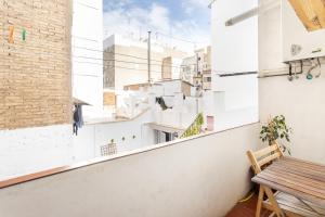 a view from the balcony of a building with a wooden table at Zona Doctor Peset - B in Valencia
