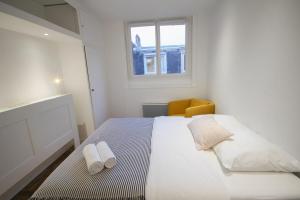 Posteľ alebo postele v izbe v ubytovaní Lille Wazemmes- Appartement avec balcon et vue