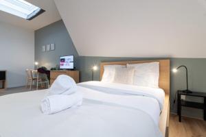 Postel nebo postele na pokoji v ubytování Lille Grand Place Nice and equipped studio!