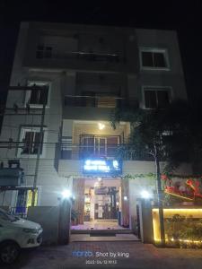 a building at night with a car parked in front at Goroomgo Blue Bell Bhubaneswar in Bhubaneshwar