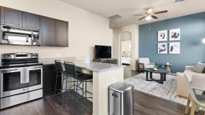 an open kitchen and living room in a apartment at Landing Modern Apartment with Amazing Amenities (ID8267X35) in Tucson