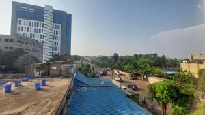 a view of a street in a city with buildings at Goroomgo New Paradise Industrial Estate Bhubaneswar in Bhubaneshwar