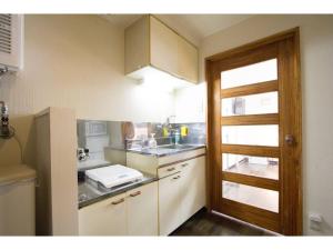 a small kitchen with a sink and a counter at Haimu Shanzerize 7,12 - Vacation STAY 11296 in Sapporo